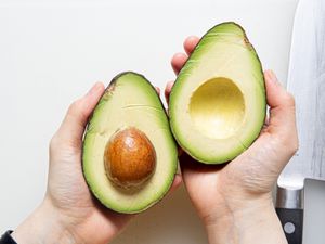 Overhead view of a cut avocado