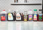 Various branded sweet tea bottles lined up on a counter