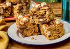 Stacked smores rice krispie treats on a plate