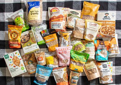 A selection of granola brands displayed on a checkered tablecloth