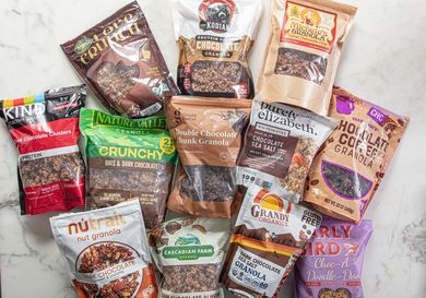 A selection of various chocolate granola brands displayed on a table