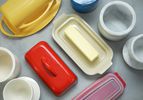 butter dishes and bells on a gray background