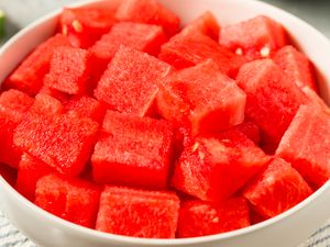 A bowl filled with diced watermelon pieces