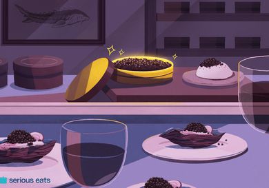 an illustration of a golden tin of caviar with caviar on oysters on plates, and glasses of wine.