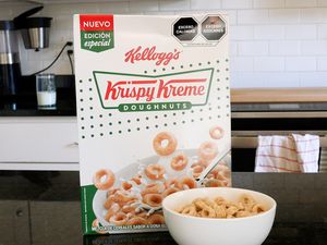 Box of Krispy Kreme cereal next to a bowl of the cereal