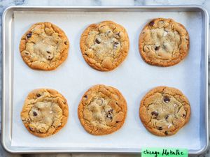 baked cookies on a piece of parchment paper on a sheet pan.